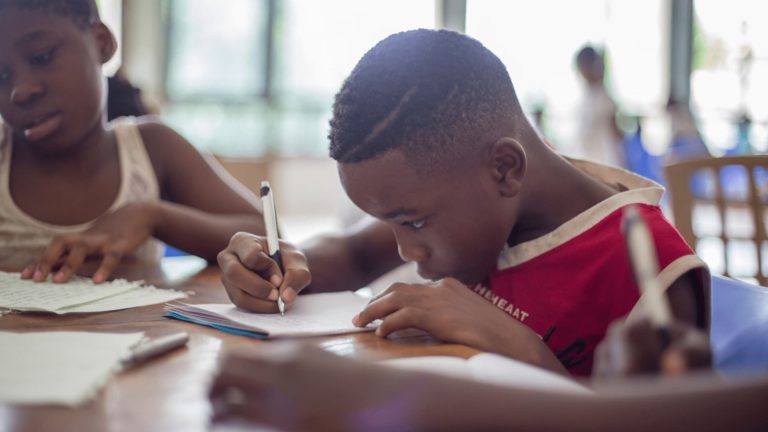 Kids focused on writing in school